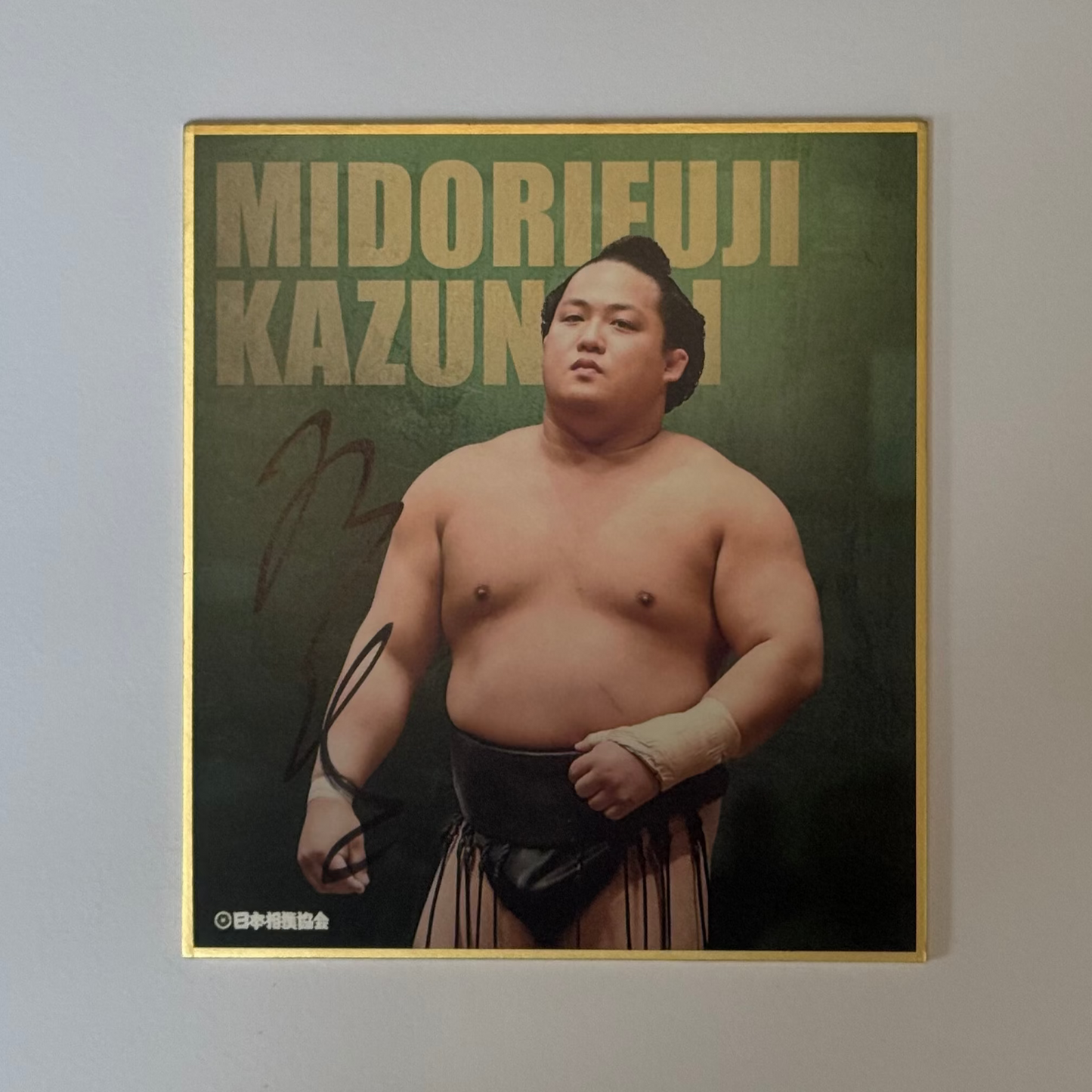 Green card with text and photo image